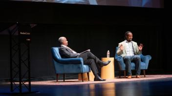 Ibram X. Kendi and Chancellor Gary S. May at 