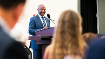 Chancellor Gary S. May standing at a podium