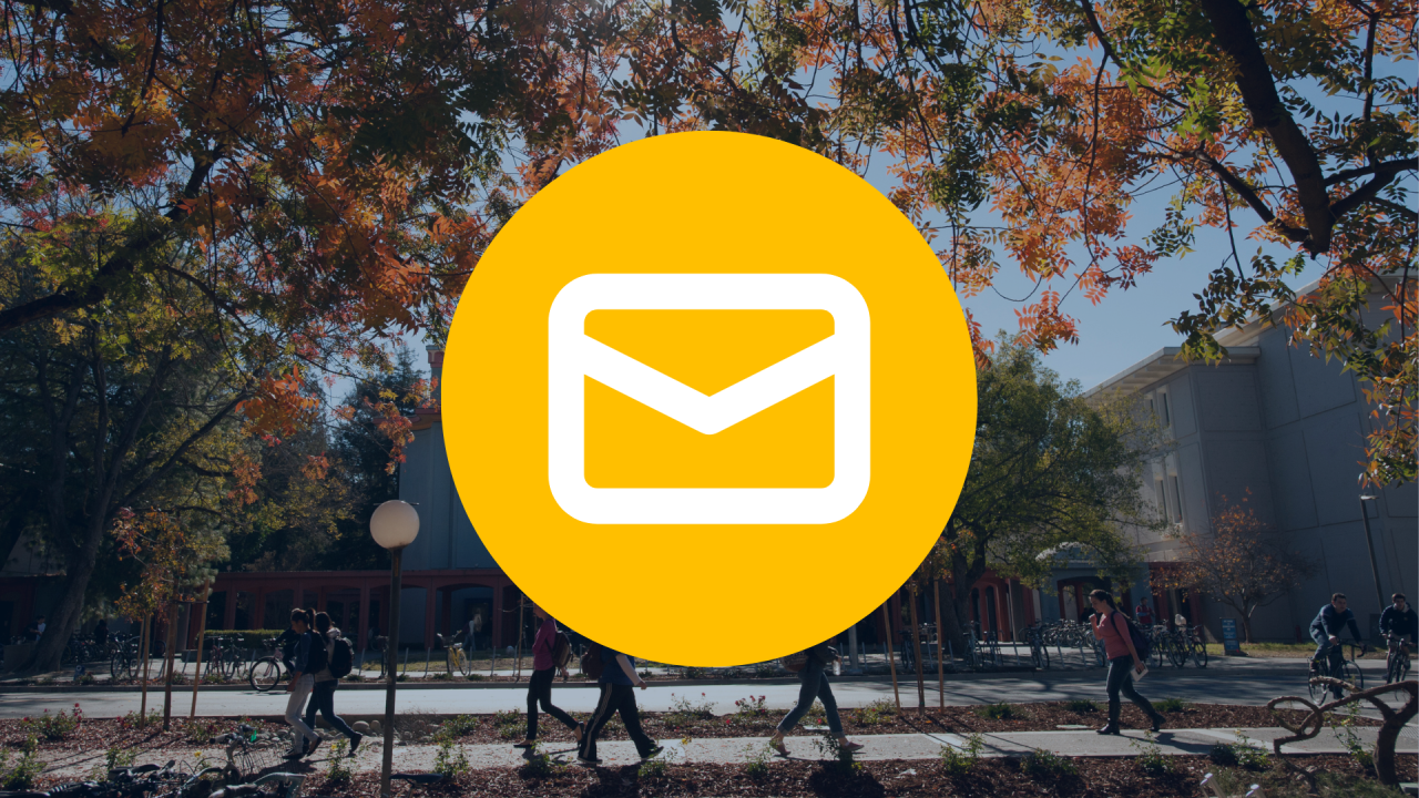 email icon over a photo of uc davis campus in the fall