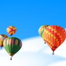 hot air balloons above clouds in sky